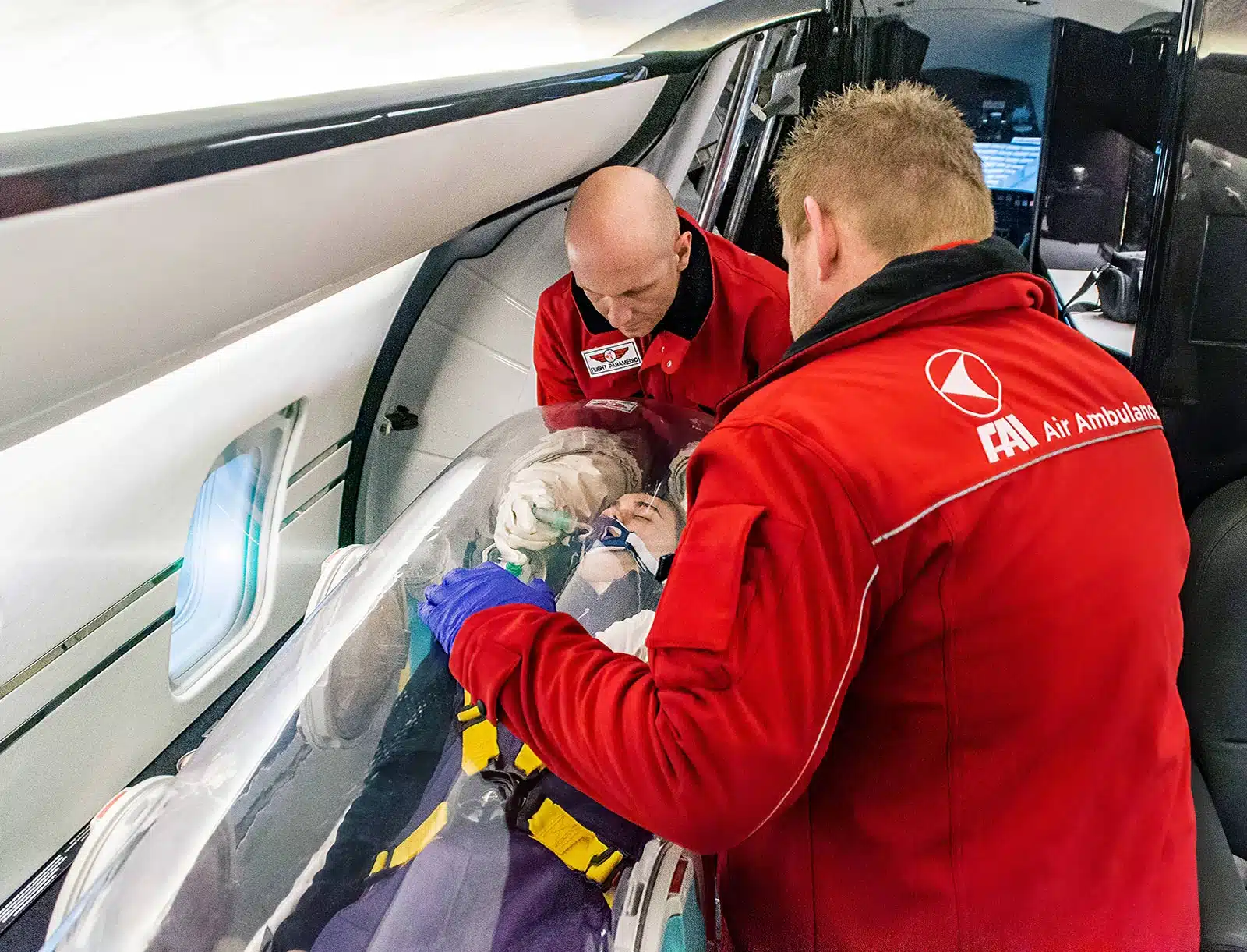 Flying Ambulance Surgical Trauma (FAST) team personnel operate in a  makeshift operating room. FAST teams were developed to shorten emergency  response time and act in addition to contingency care facilities recently  established